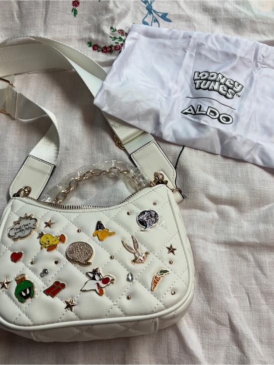 Aldo Handbags - Aldo White Quilted Mini Crossbody with Looney Tunes Pins